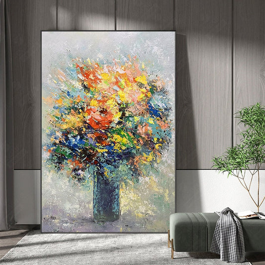 May include: A colorful abstract painting of a bouquet of flowers in a blue vase. The flowers are painted in a variety of colors, including red, yellow, blue, green, and pink. The background is a light gray color.