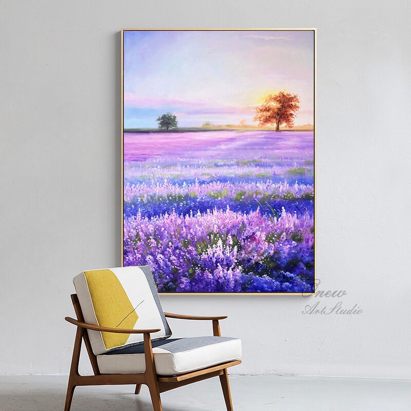 May include: A painting of a lavender field with a sunset in the background. The field is filled with purple flowers and the sky is a mix of pink, orange, and yellow. There are two trees in the distance, one on each side of the field.