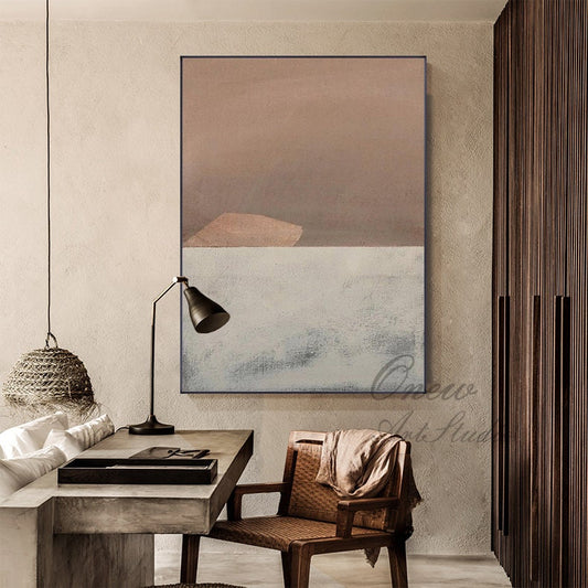 May include: Abstract painting with a brown, beige, and white color scheme. The painting is framed and hanging on a wall in a room with a desk and chair.