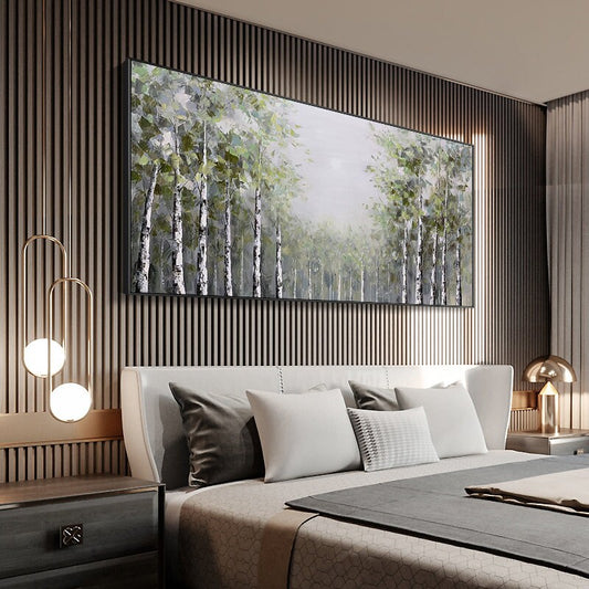 May include: A large, rectangular canvas painting depicting a forest scene with a muted color palette. The painting features a group of birch trees with white bark and green leaves, set against a hazy background. The painting is framed in black and hangs on a wall with vertical wood paneling.