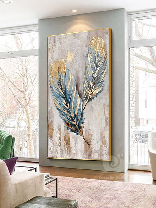 May include: A painting of two blue and gold feathers on a white background with a gold frame.