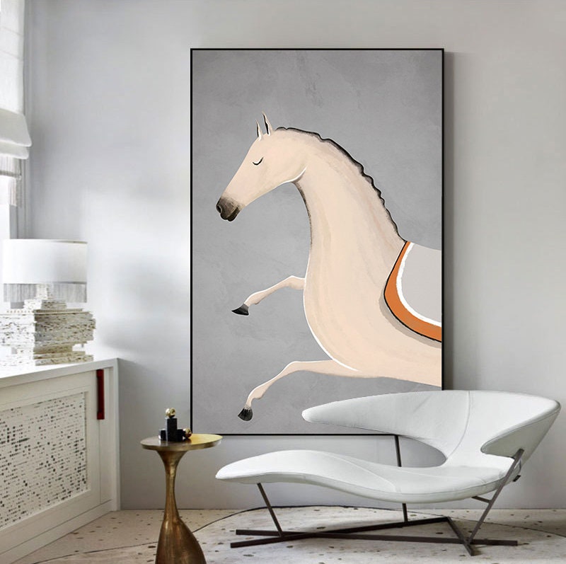 May include: A painting of a white horse with an orange and gray saddle, leaping against a gray background.