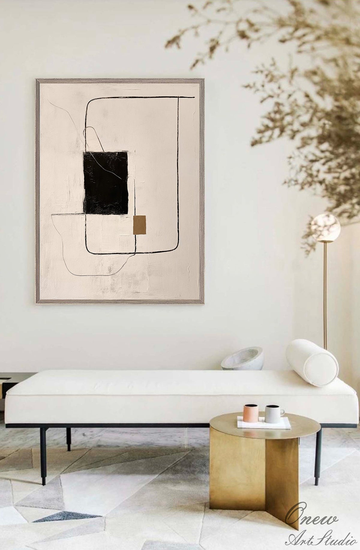 May include: Abstract art painting with black, brown, and white lines and shapes on a beige background. The painting is framed in a light brown frame and is hanging on a white wall.
