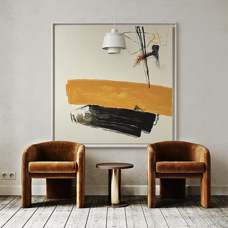 May include: Two brown velvet armchairs with a brown wooden side table in front of a large abstract painting with yellow, black, and white brushstrokes. The painting is framed in a thin, white frame.