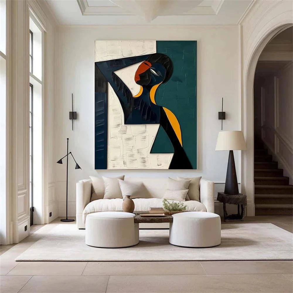 May include: Abstract painting of a figure with a dark blue head and arm, a yellow neck, and a black body. The background is divided into white and teal sections. The artwork hangs above a cream-colored sofa in a modern living room.