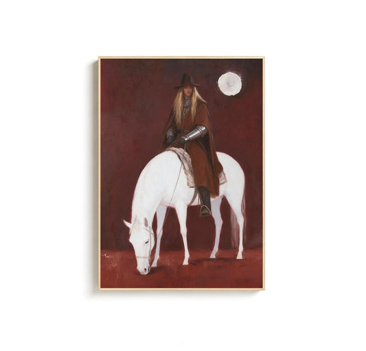 May include: A framed art print depicts a person in a brown cloak and hat riding a white horse. The background is a deep red with a white moon. The artwork has a vintage, painterly style.