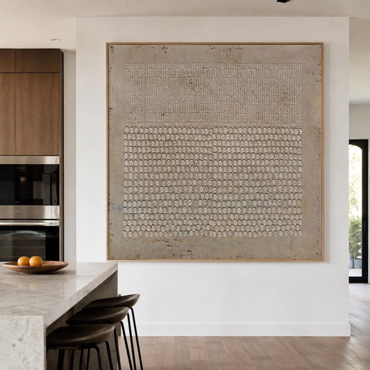 May include: A large square wall art piece featuring a textured beige and taupe surface. The upper section displays a pattern of vertical lines, while the lower section consists of a dense grid of small, raised circular shapes within a wooden frame.