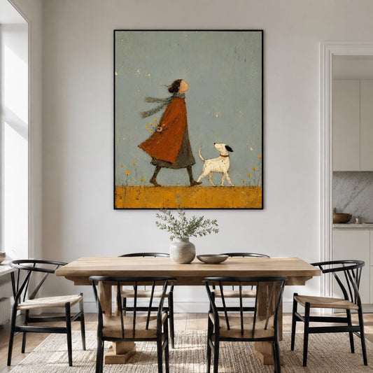 May include: A framed wall art print featuring a stylized illustration of a person wearing a long orange coat and a scarf, walking alongside a small white dog with black spots. The background is a muted blue-gray sky over a mustard yellow field.