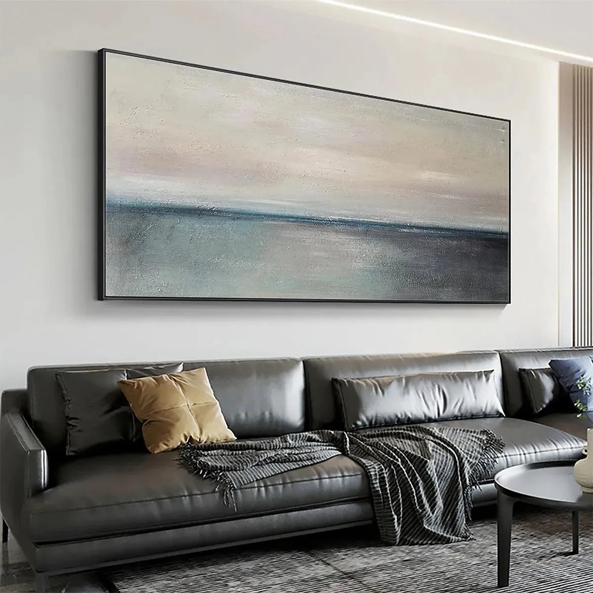 Serene Horizon hand-painted ocean blue, ivory and soft neutral tones textured coastal abstract painting shown with silver frame