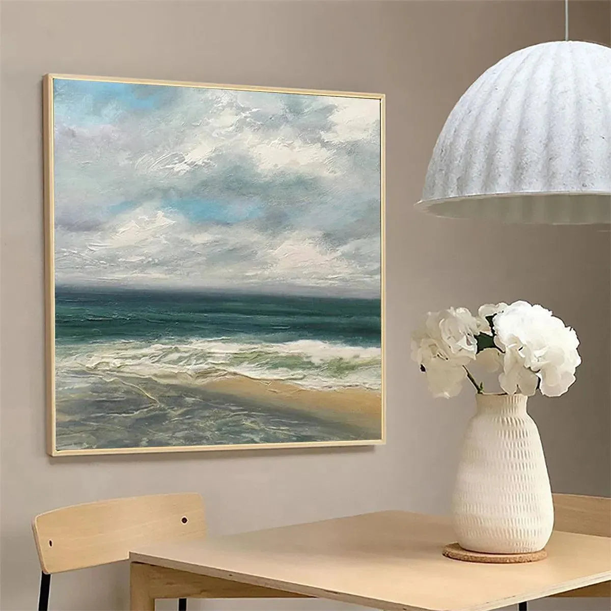 Cloudy Coastal Scene hand-painted ocean blue, ivory and soft neutral tones textured coastal landscape painting shown with silver frame