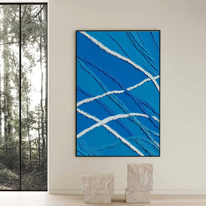 Aegean Tides hand-painted white and ocean blue textured ocean wave painting shown with black frame