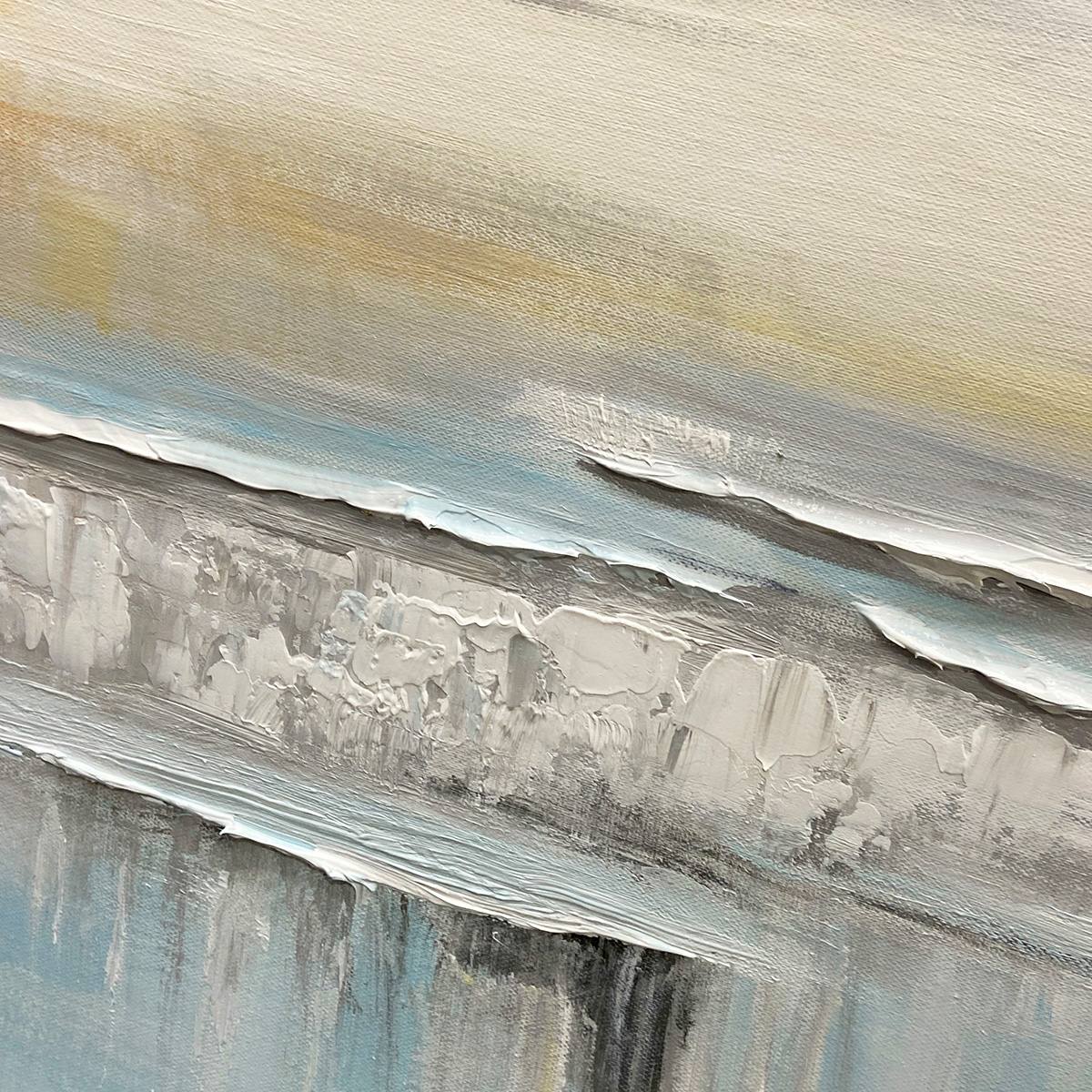 Coastal Serenity hand-painted white, soft grey, ocean blue and gold textured ocean wave painting shown with black frame