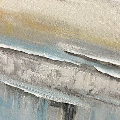Coastal Serenity hand-painted white, soft grey, ocean blue and gold textured ocean wave painting shown with black frame