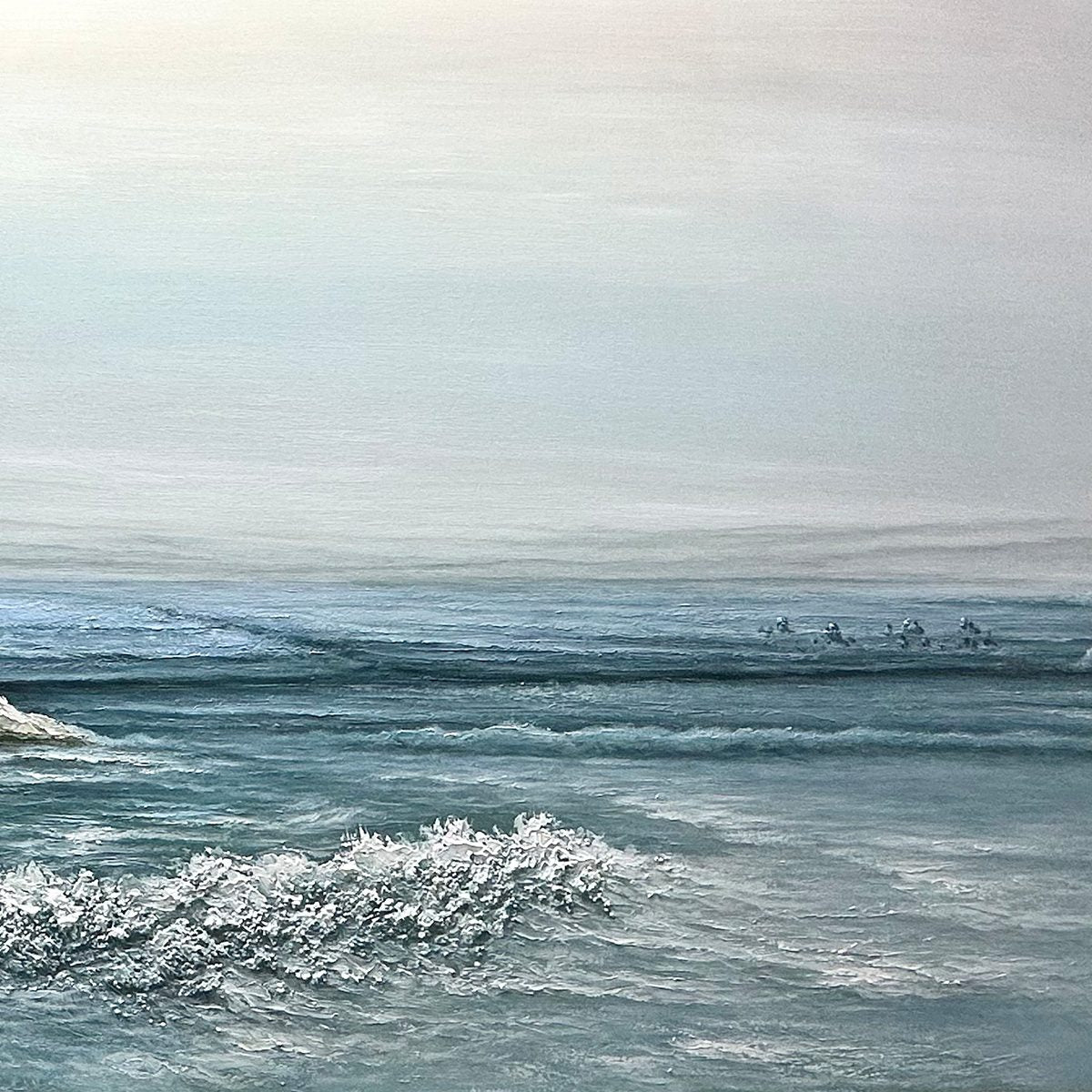 Coastal Whispers hand-painted ocean blue, ivory and soft neutral tones textured coastal landscape painting shown with silver frame