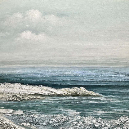 Coastal Whispers hand-painted ocean blue, ivory and soft neutral tones textured coastal landscape painting shown with wood frame
