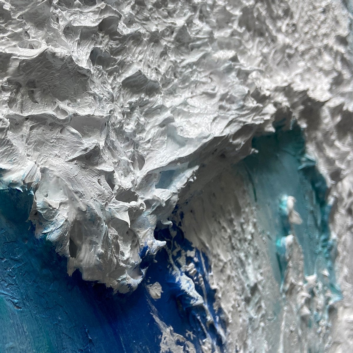 Cresting Wave hand-painted white and ocean blue textured ocean wave painting shown with wood frame