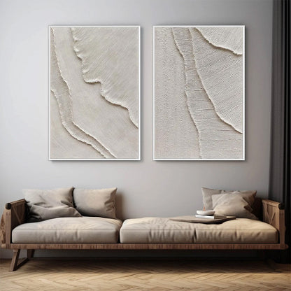 Etched In Stone hand-painted white and soft beige textured ocean wave painting shown with black frame