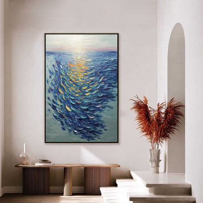 Golden Tide hand-painted gold and ivory textured school of fish painting shown with silver frame