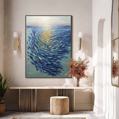 Golden Tide hand-painted gold and ivory textured school of fish painting shown with black frame
