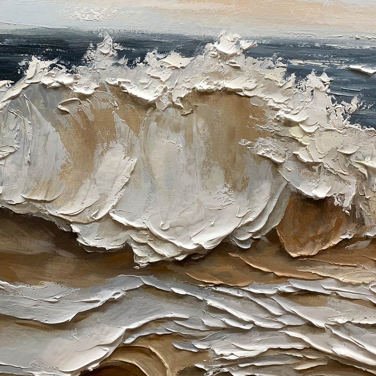 Coastal Crescendo hand-painted ocean blue, ivory and soft neutral tones textured ocean wave painting shown with silver frame