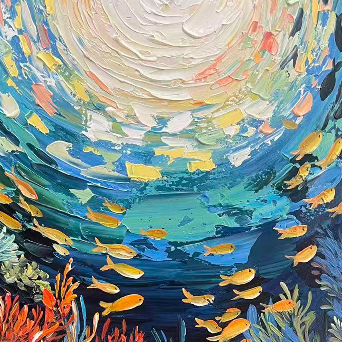 Ocean’s Grace hand-painted gold and coral textured school of fish painting shown with silver frame