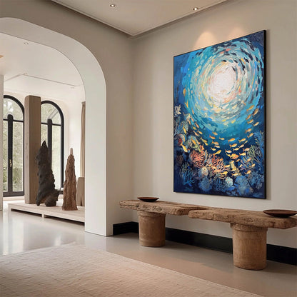 Ocean’s Grace hand-painted gold and coral textured school of fish painting shown as stretched canvas
