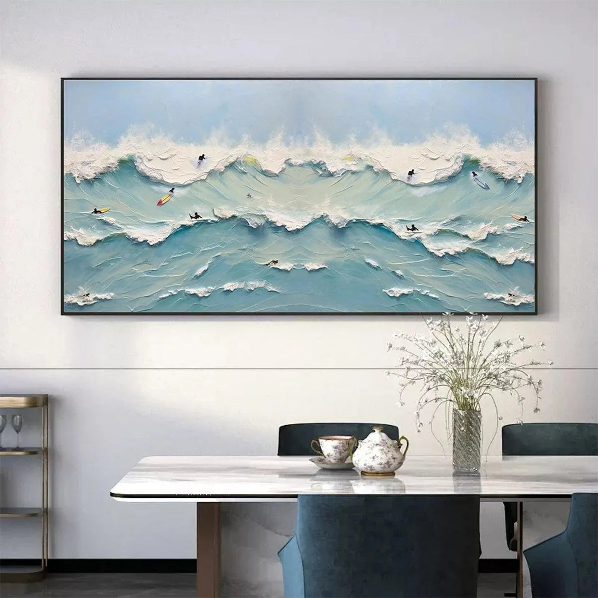 Ocean's Heartbeat hand-painted ocean blue, ivory and soft neutral tones textured surfer ocean painting shown with black frame