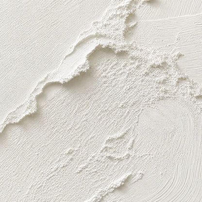 Riven hand-painted white and soft beige textured ocean wave painting shown with gold frame