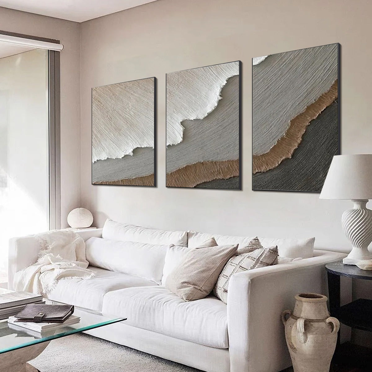 Terra Firma hand-painted beige, soft grey, charcoal and earth brown textured coastal abstract painting shown with gold frame