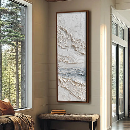 Tideline hand-painted white, soft grey and ocean blue textured coastal abstract painting shown with wood frame
