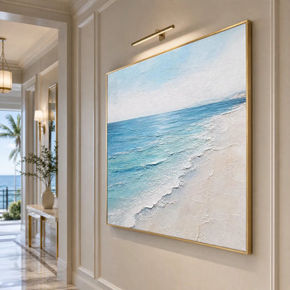 Whispering Tide hand-painted ocean blue, ivory and soft neutral tones textured beach scene painting shown with black frame
