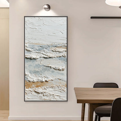 Whispering Tides hand-painted white, beige and ocean blue textured coastal abstract painting shown with silver frame
