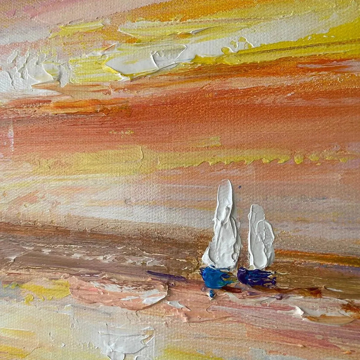 Sailing At Sunset hand-painted ocean blue, ivory and soft neutral tones textured sailboat seascape painting shown with wood frame