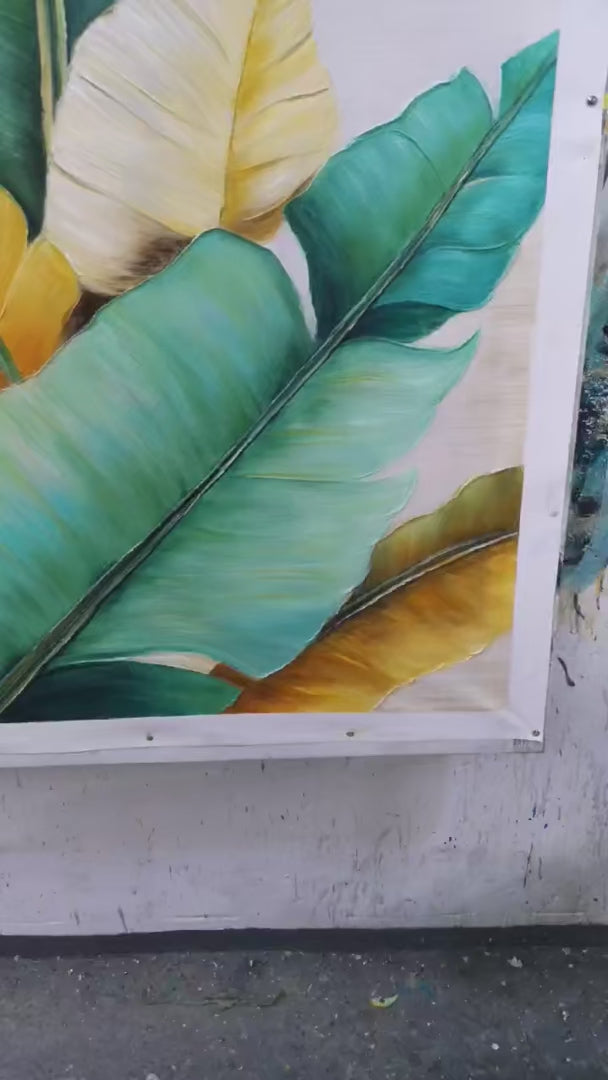 Tropical Abundance hand-painted green, gold and yellow textured botanical painting shown with silver frame