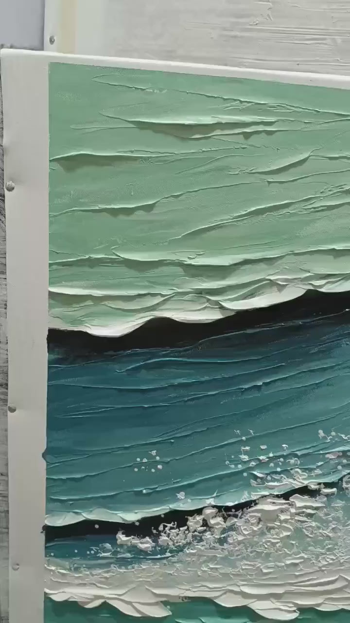 Coastal Textures hand-painted ocean blue, ivory and soft neutral tones textured coastal abstract painting shown with silver frame