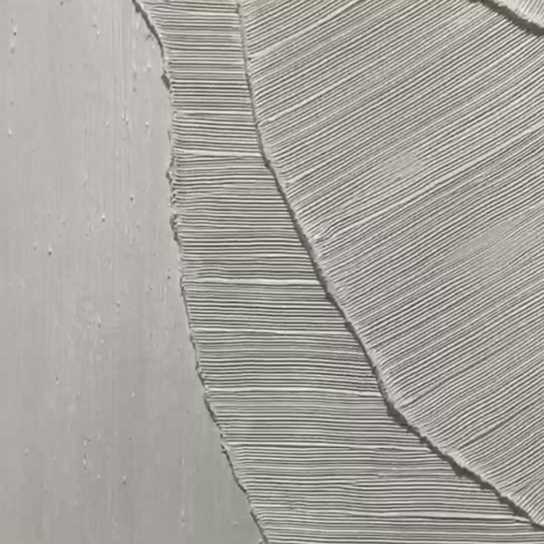 Etched In Stone hand-painted white and soft beige textured ocean wave painting shown with gold frame