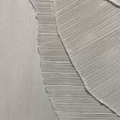 Etched In Stone hand-painted white and soft beige textured ocean wave painting shown with gold frame