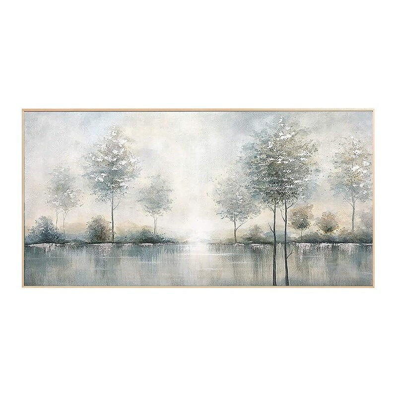 May include: A landscape painting featuring a serene waterscape with trees. The artwork uses a muted color palette of blues, grays, and whites, creating a tranquil and atmospheric scene. The painting is framed in a light-colored wooden frame.