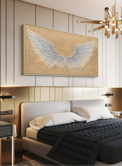May include: A framed canvas painting of white angel wings on a beige background. The painting is hanging on a wall in a bedroom with a bed and nightstands.