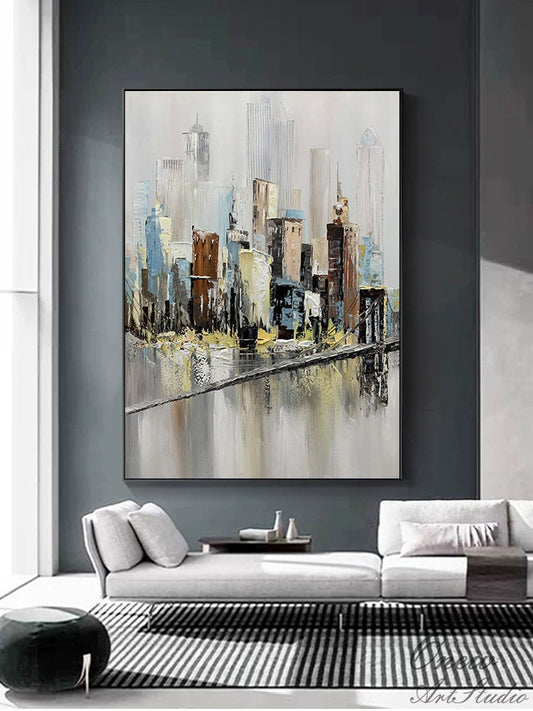 May include: Abstract painting of a cityscape with a bridge in the foreground. The painting is done in shades of gray, blue, brown, and yellow. The buildings are tall and slender, and the bridge is a simple, straight line.