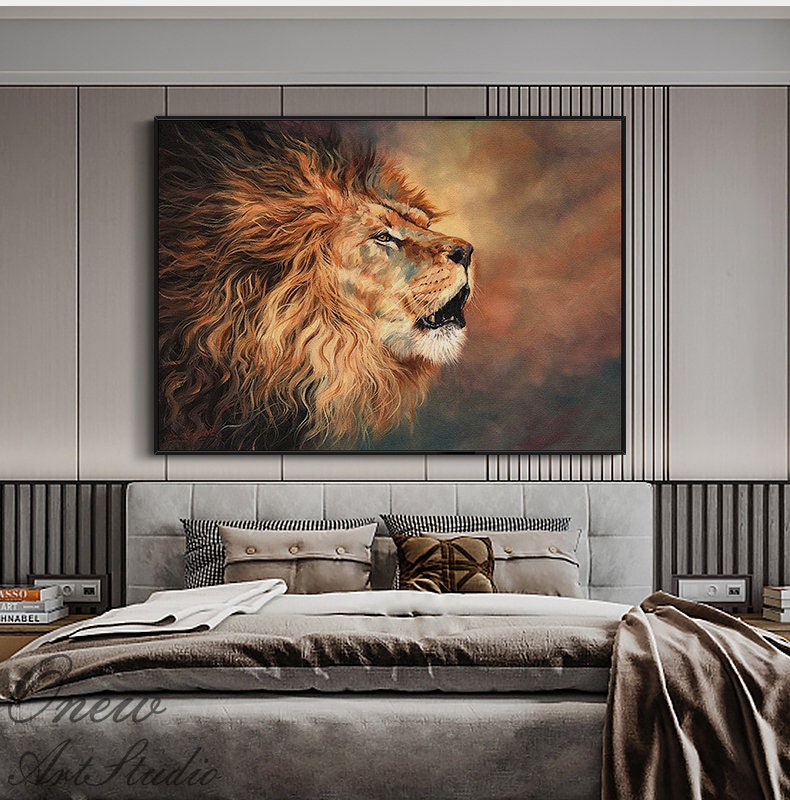 May include: A framed canvas art print of a lion's head, roaring with its mouth open. The lion's mane is a mix of orange and brown hues, with a dark background. The artwork is displayed above a bed with gray bedding and pillows.