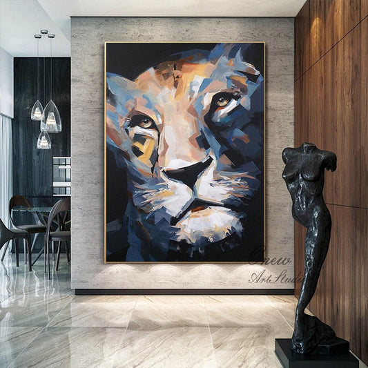 May include: Large abstract painting of a lion's face in shades of blue, beige, and black. The artwork is framed in gold and hangs on a gray wall. A dark sculpture of a female form stands nearby.