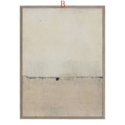 May include: Abstract art print in a light beige and gray color scheme. The print features a horizontal line dividing the canvas into two sections. The top section is a lighter beige, while the bottom section is a darker gray. The print is framed in a light wood frame.