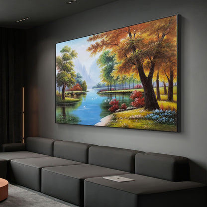 May include: A painting of a serene landscape with a river winding through a forest. The trees are in shades of green, yellow, and orange, and the water is a bright blue. The painting is framed in black.
