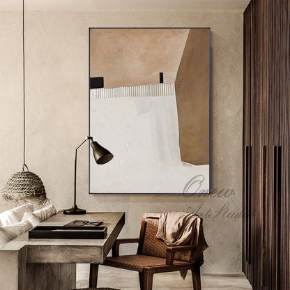 May include: Abstract painting with brown and white geometric shapes on a canvas. The painting is hanging on a wall in a room with a wooden floor and a wooden chair.