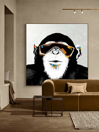 May include: A black and white illustration of a monkey wearing large, gold-rimmed sunglasses and a colorful beaded necklace. The monkey has a white beard and is looking directly at the viewer.