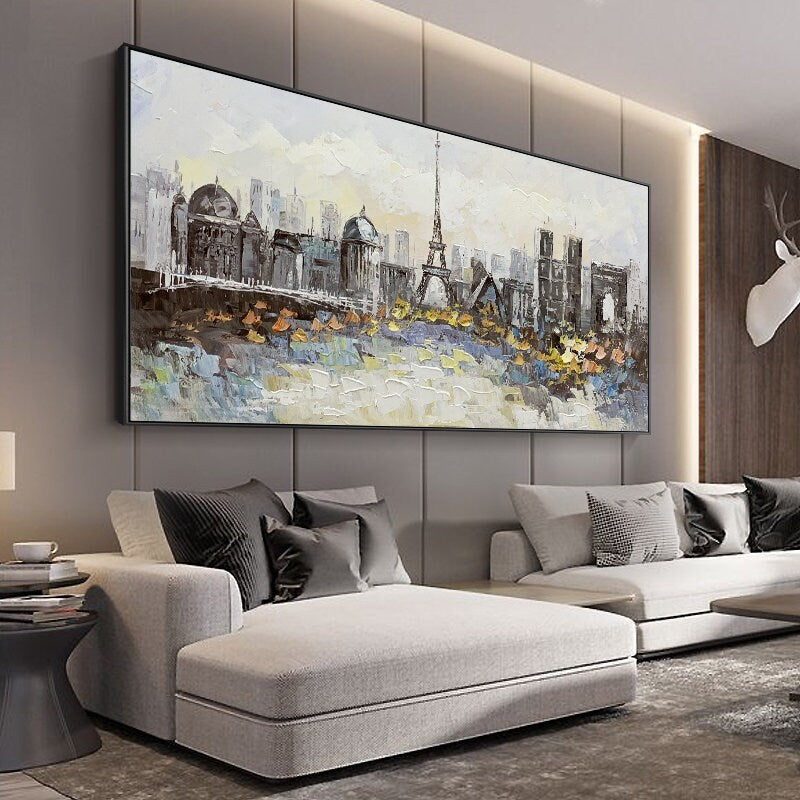 May include: A painting of a cityscape with a prominent Eiffel Tower in the center. The painting is done in a stylized, abstract style with a mix of gray, white, and yellow colors.