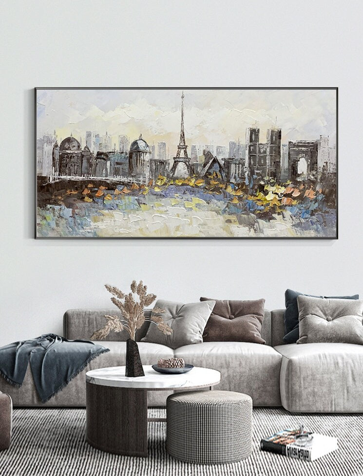 May include: A painting of a cityscape with the Eiffel Tower in the center. The painting is done in a textured style with a palette of gray, white, and yellow.