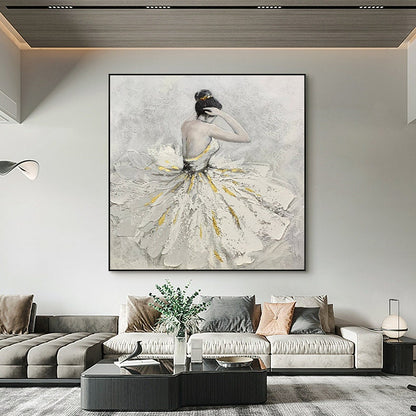 May include: A painting of a ballerina in a white tutu with gold accents. The ballerina is facing away from the viewer and has her hair pulled back in a bun. The background is a light gray.