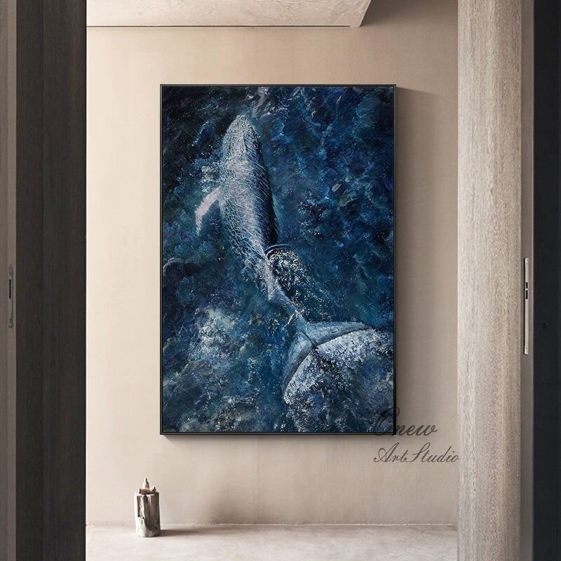 May include: A painting of a whale breaching in a blue and white ocean. The whale is white with a dark blue outline. The ocean is a deep blue with white waves.